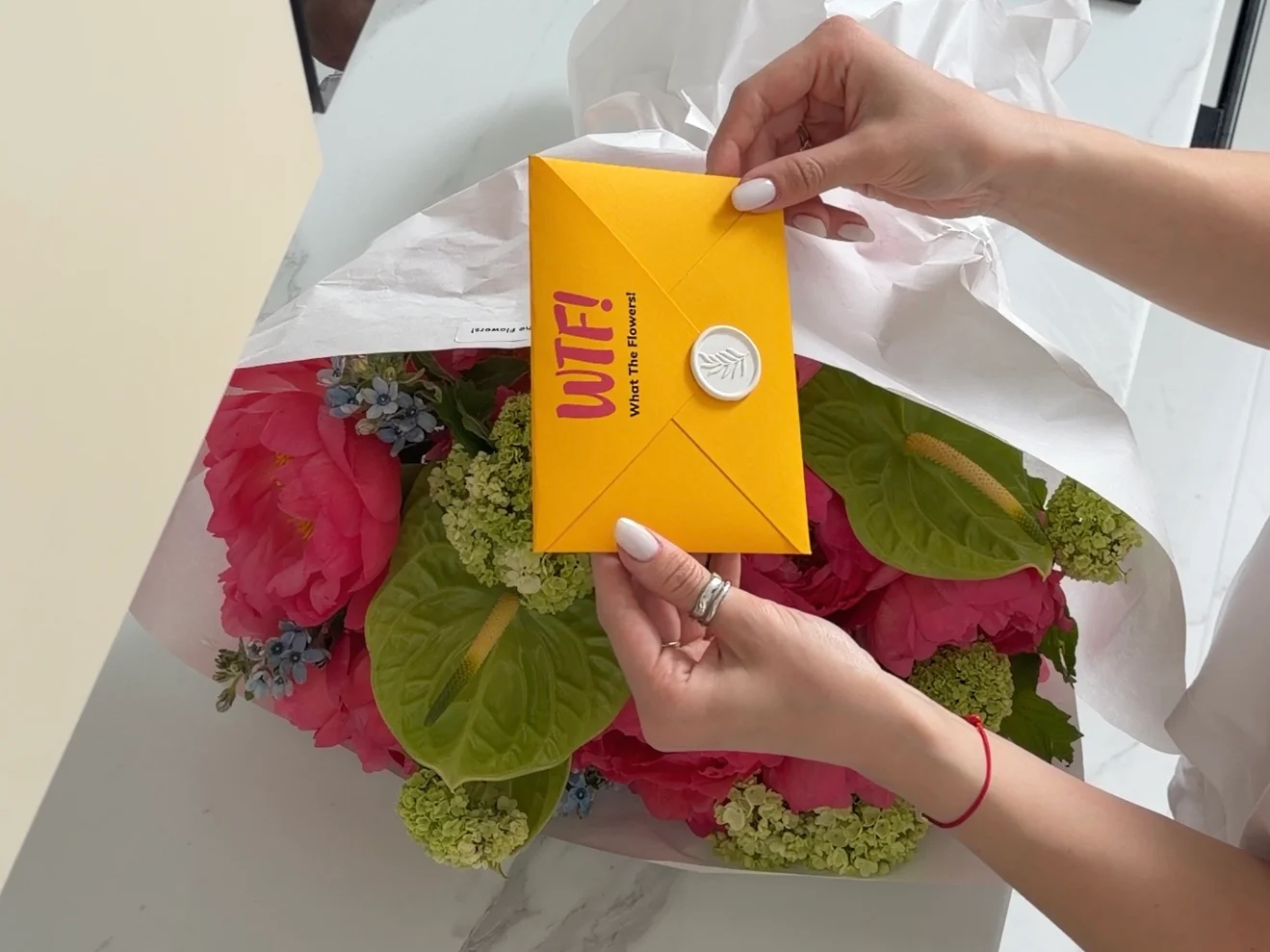 Bouquet with yellow WTF! envelope — flower subscription